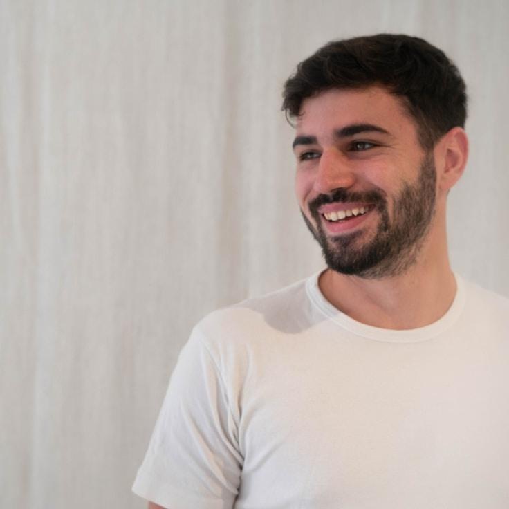 Alex Rivera, Lead Design Curator at Cozy Market Breeze, reviewing corporate floral arrangements